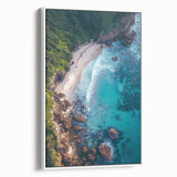Framed canvas artwork showcasing a dramatic cliff landscape with vibrant colors and intricate details, presented in a sleek white frame, perfect for modern decor.
