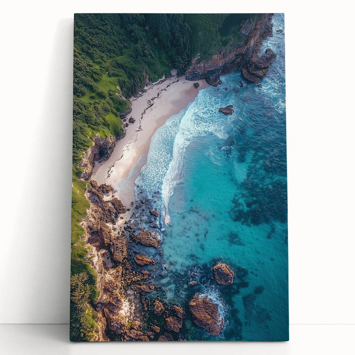 Stretched canvas artwork showcasing a dramatic cliff landscape with vibrant colors, perfect for home decor, leaning against a wall to emphasize its artistic depth.