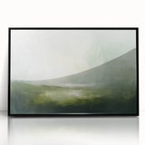 Framed acrylic wall art showcasing an abstract landscape design in muted tones of blue and green, with a sleek black frame, ideal for modern home decor.
