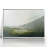 Framed abstract landscape wall art featuring soft, blended hues of blue and white, designed to enhance modern interiors with a serene aesthetic.