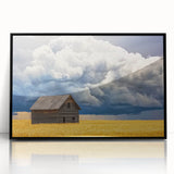 Black-framed acrylic artwork of a serene landscape featuring a tranquil barn scene, ideal for home décor. The piece showcases vibrant colors and intricate details, enhancing any interior space. Perfect for rustic or modern settings, this artwork adds warmth and character to walls.