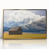 Framed acrylic wall art featuring a scenic landscape with a barn, highlighted by gold accents. Perfect for enhancing home decor with rustic charm.