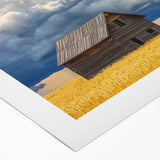 Rolled canvas showcasing a vibrant landscape barn design, featuring rich colors and detailed textures, securely rolled in a protective cardboard tube for shipping.