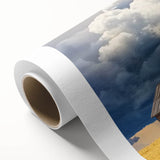 Rolled canvas showcasing a vibrant landscape design with a rustic barn, featuring rich colors and intricate details, securely packaged in a durable cardboard tube for safe shipping.