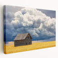 Stretched canvas artwork showcasing a serene landscape scene with a rustic barn, featuring vibrant colors and intricate details, ideal for home decor.