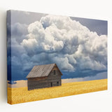 Stretched canvas artwork showcasing a serene landscape scene with a rustic barn, featuring vibrant colors and intricate details, ideal for home decor.