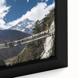 Close-up of a framed landscape canvas print showcasing a serene bridge over a tranquil river, featuring vibrant colors and intricate details, perfect for home decor.