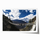 Landscape bridge rolled canvas print showcasing a serene river view with lush greenery and a vibrant blue sky, displayed in a protective cardboard tube for safe shipping.