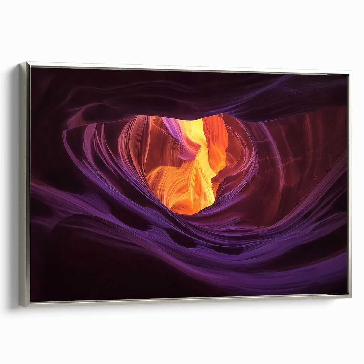 Framed canvas artwork showcasing a stunning landscape of canyons, featuring vibrant colors and intricate details, displayed with a sleek silver frame, ideal for home decor.