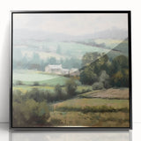 Framed acrylic wall art depicting a serene landscape of rolling countryside hills, featuring lush greenery and soft blue skies, with a sleek black frame enhancing its modern aesthetic. Perfect for home decor, this piece adds a touch of nature-inspired elegance to any room.