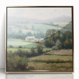 Framed acrylic wall art depicting a serene countryside landscape with rolling hills, lush greenery, and a vibrant sky, accented by a gold frame for elegance.