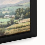 Framed canvas wall art depicting a serene countryside landscape with vibrant green fields and a clear blue sky, showcasing natural beauty in a close-up view.