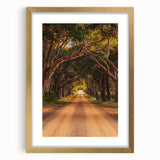 Golden-framed landscape artwork featuring a serene countryside scene, accented with a white matting, ideal for home decor and interior design enhancement.