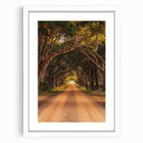 White-framed landscape artwork showcasing a serene countryside scene with rolling hills and a clear blue sky, perfect for home decor and art enthusiasts.