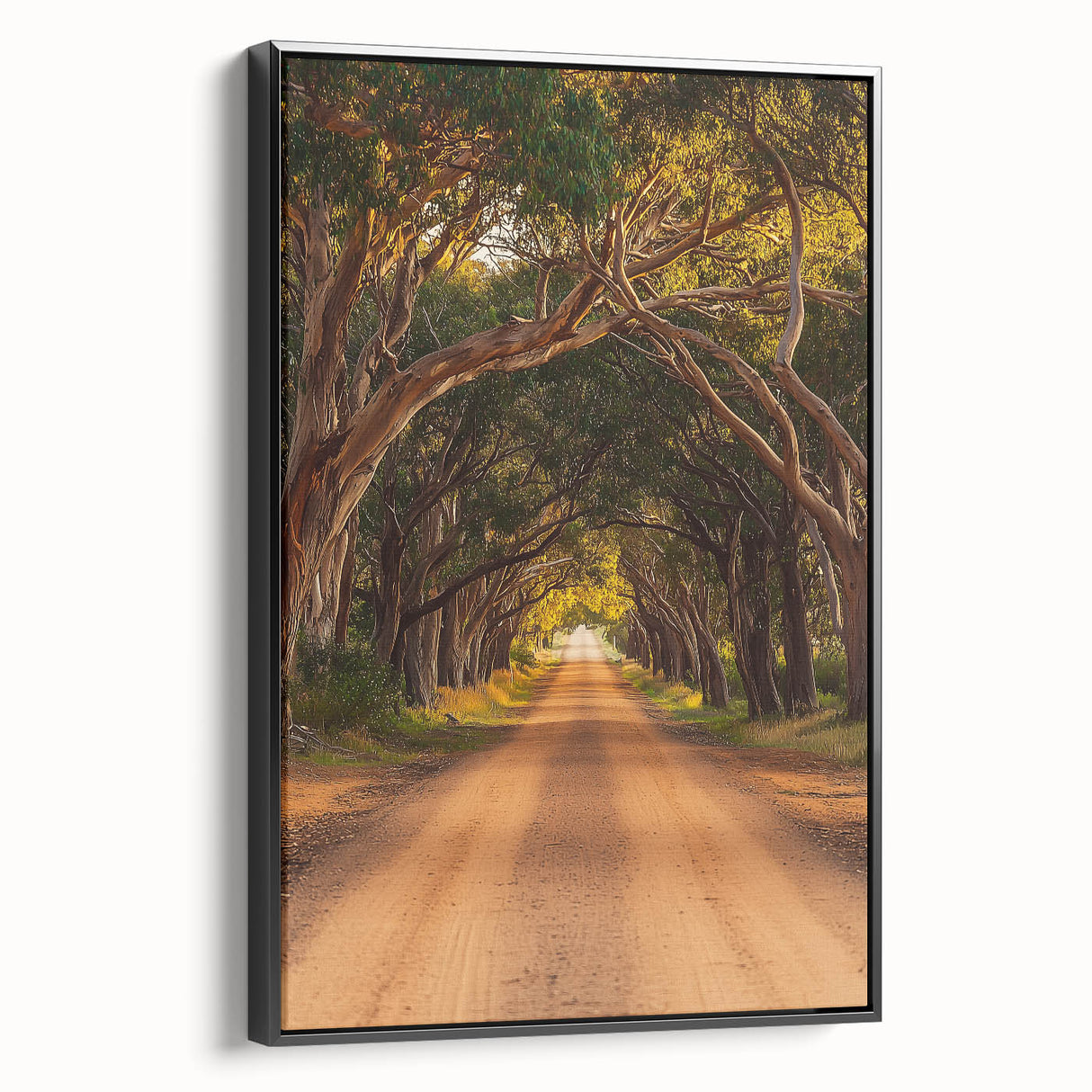 Framed canvas artwork showcasing a serene countryside landscape, featuring vibrant greens and soft blue skies, presented in a sleek black frame, ideal for home decor.