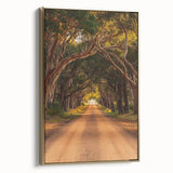 Framed canvas artwork depicting a serene countryside landscape with vibrant greens and golden accents, showcasing a side view of the elegant frame.