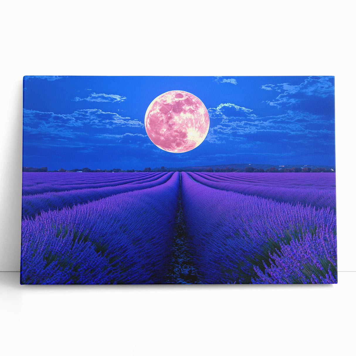 Stretched canvas artwork depicting a vibrant landscape of rolling green fields under a bright blue sky, leaning against a rustic wooden surface, ideal for home decor.
