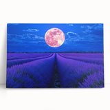 Stretched canvas artwork depicting a vibrant landscape of rolling green fields under a bright blue sky, leaning against a rustic wooden surface, ideal for home decor.