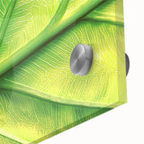 Large abstract floral design in vibrant orange and red tones on acrylic glass.