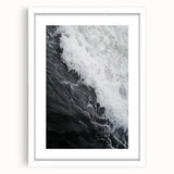 Abstract art print featuring close-up nature elements in muted green and brown tones, framed with a white mat.