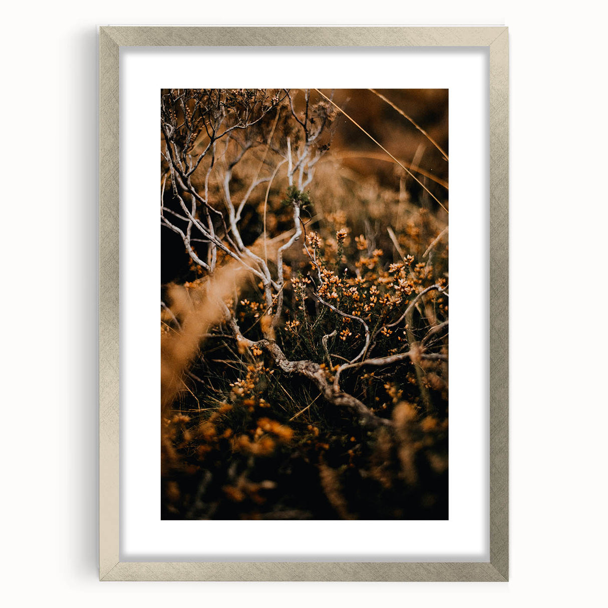Textured abstract art print depicting autumnal shades on a framed silver canvas, suitable for bedroom decor.