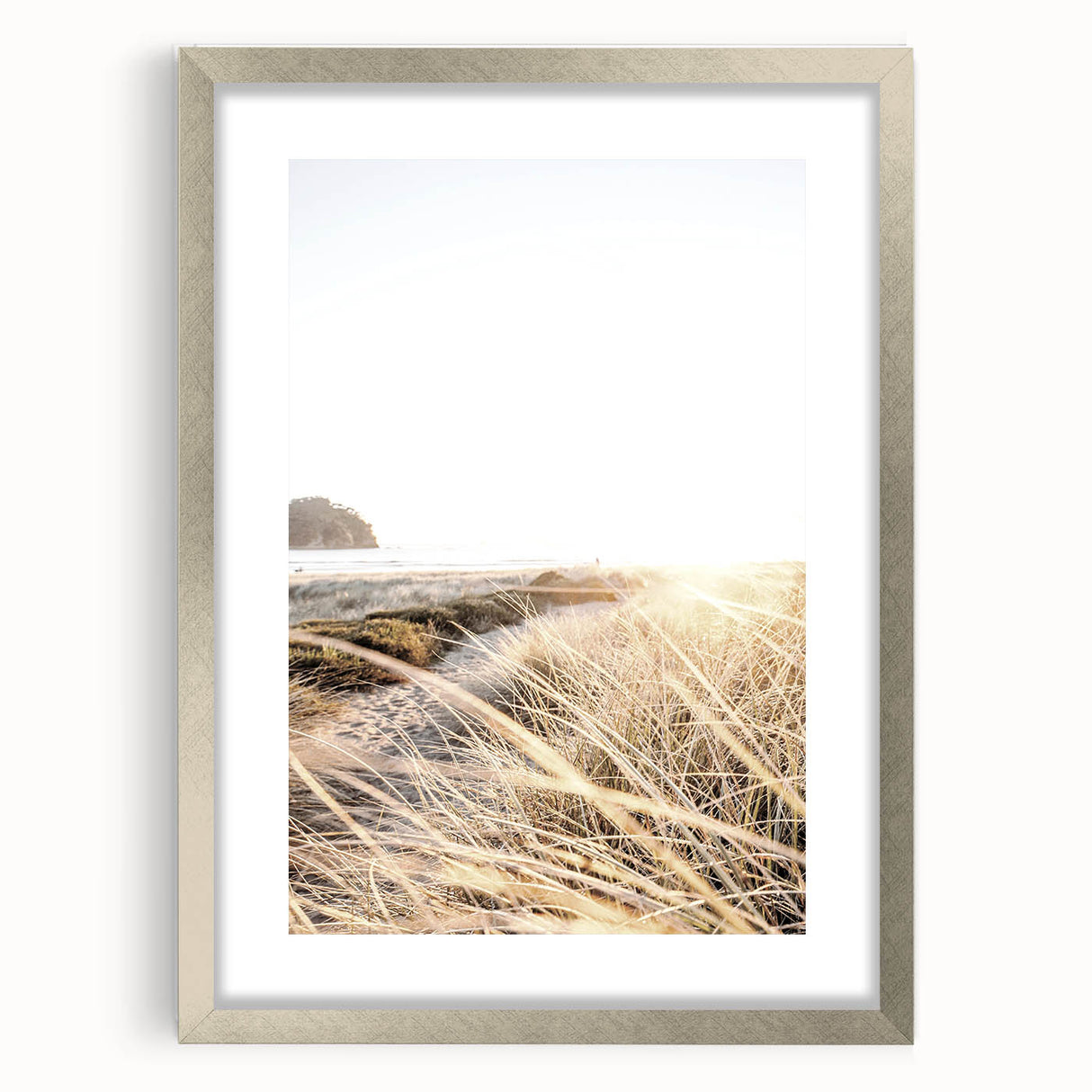 Textured abstract art print in vibrant orange and yellow shades, framed in silver, ideal for bedroom wall decor.