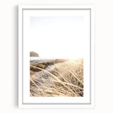 Abstract art print depicting vibrant summer hues on a white framed canvas, suitable for bedroom or dining room decor.