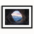 Framed landscape art print showcasing a serene cave scene with a black mat, perfect for home décor. The artwork features rich colors and detailed textures, ideal for enhancing any living space.