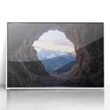 Framed acrylic artwork depicting a serene landscape with caves, featuring vibrant colors and intricate details, set against a sleek white frame, ideal for modern decor.