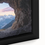 Close-up of a framed canvas depicting a vibrant landscape with intricate caves, showcasing rich colors and textures that enhance the artistic depth. Ideal for home decor.