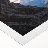 Rolled canvas showcasing a vibrant landscape with intricate cave designs, featuring earthy tones and textures, ideal for home decor or art enthusiasts.