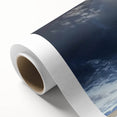 Rolled canvas showcasing a vibrant landscape barn design, featuring rich colors and detailed textures, securely packaged in a protective cardboard tube for easy transport.