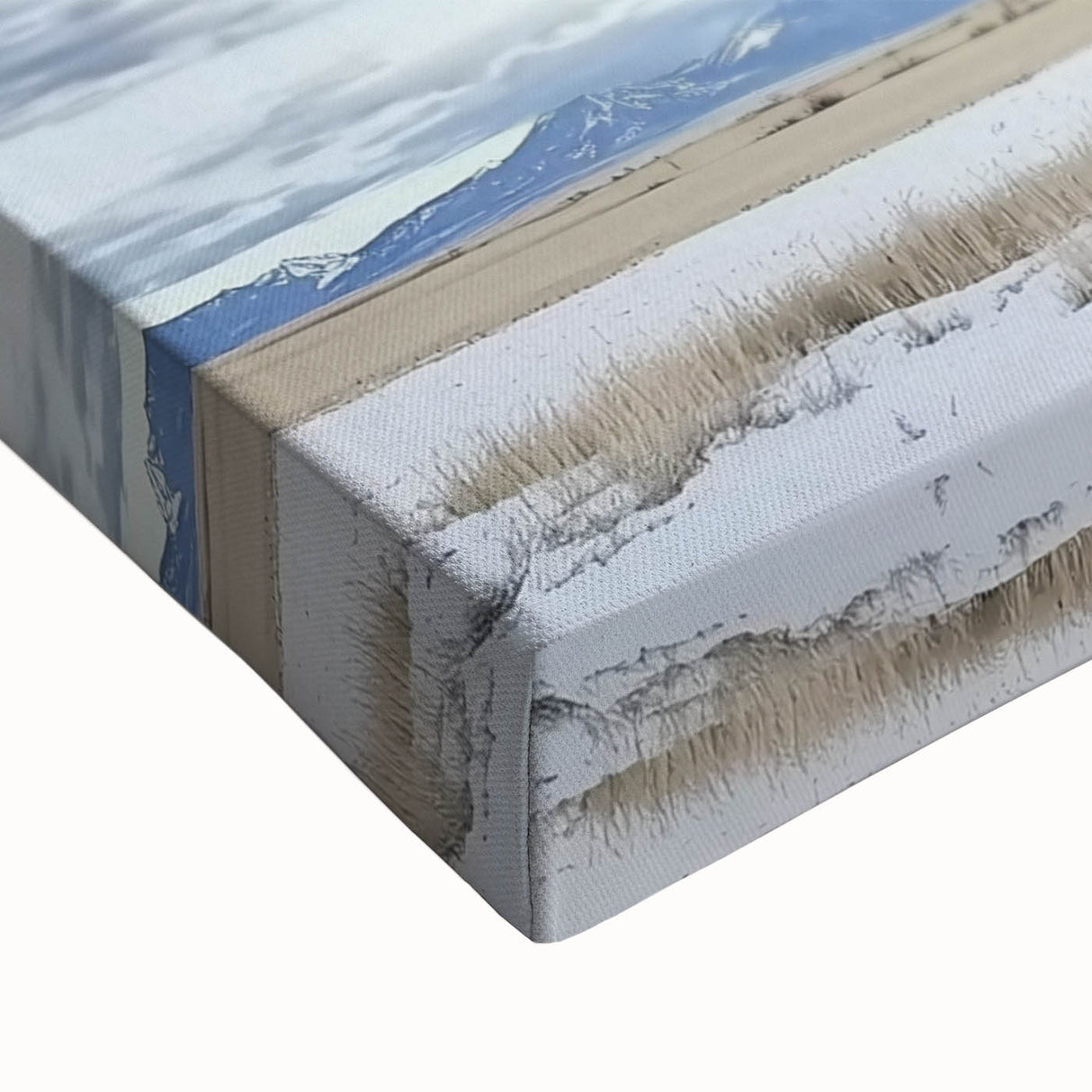 Close-up of a stretched canvas showcasing a vibrant landscape design featuring a rustic barn surrounded by lush greenery, perfect for home decor.
