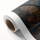 Rolled canvas showcasing a vibrant landscape bridge design with intricate details and rich colors, securely housed in a protective cardboard tube for safe shipping.