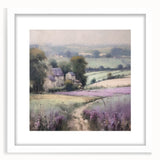 Framed landscape wall art depicting a serene countryside scene with vibrant green fields and a clear blue sky, showcased in a sleek white mat for an elegant finish.