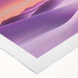 Vibrant rolled canvas artwork depicting a stunning desert landscape at sunset, showcasing warm hues of orange and yellow against a serene blue sky, ideal for home decor.