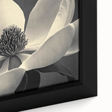 Close-up of a black framed canvas featuring vibrant, textured floral designs in multiple colors.