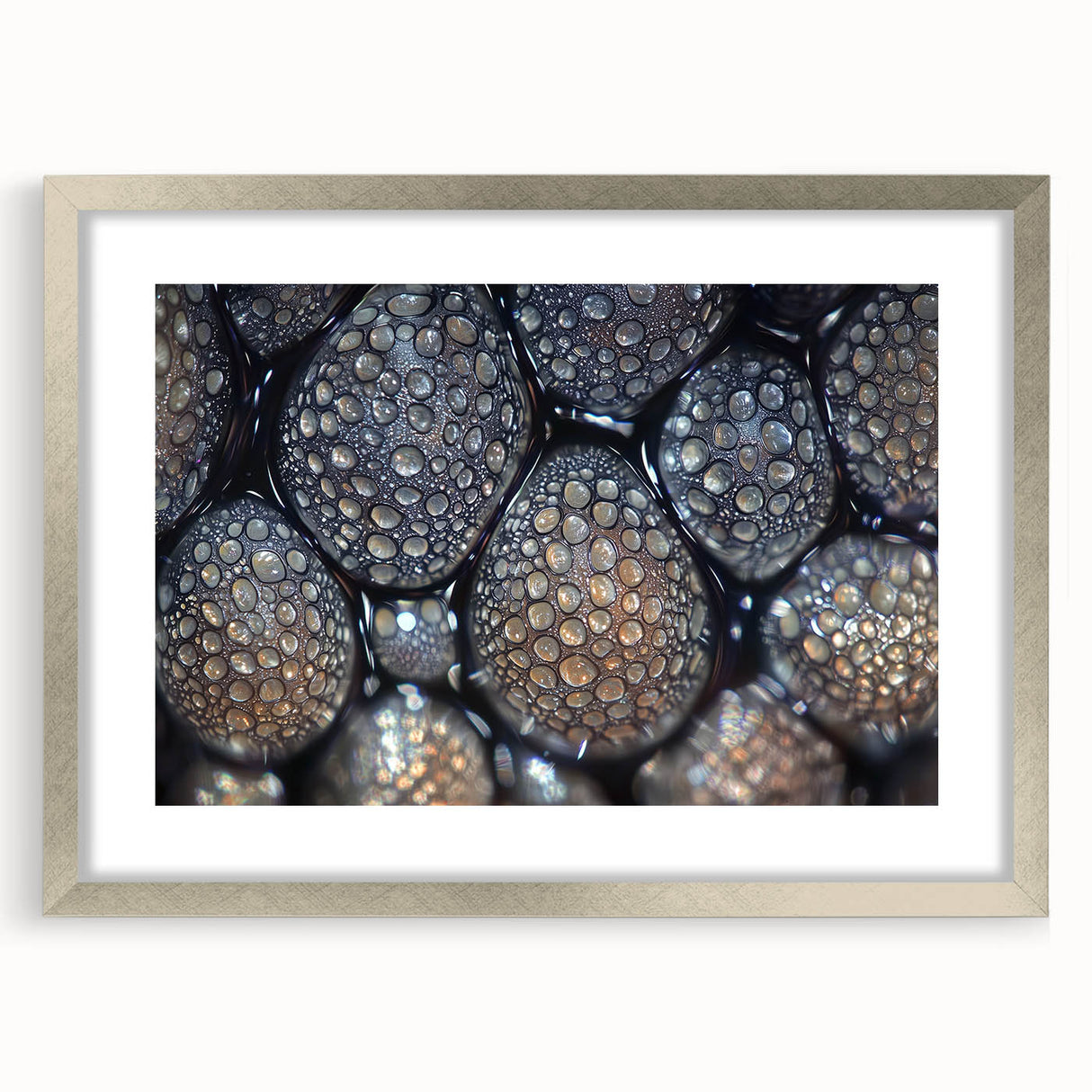 Textured abstract art print featuring close-up nature elements in muted greens and browns, framed in silver.