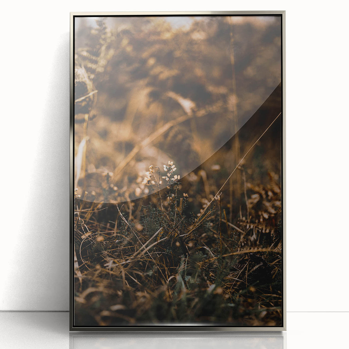 Mid-century modernist art depicting autumn trees in muted orange and brown tones, framed in silver acrylic.