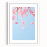 Abstract art print featuring spring-themed elements in soft green and pink, framed in white.