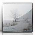 Large abstract wall art featuring a winter scene in muted blue and white tones, framed in black acrylic.