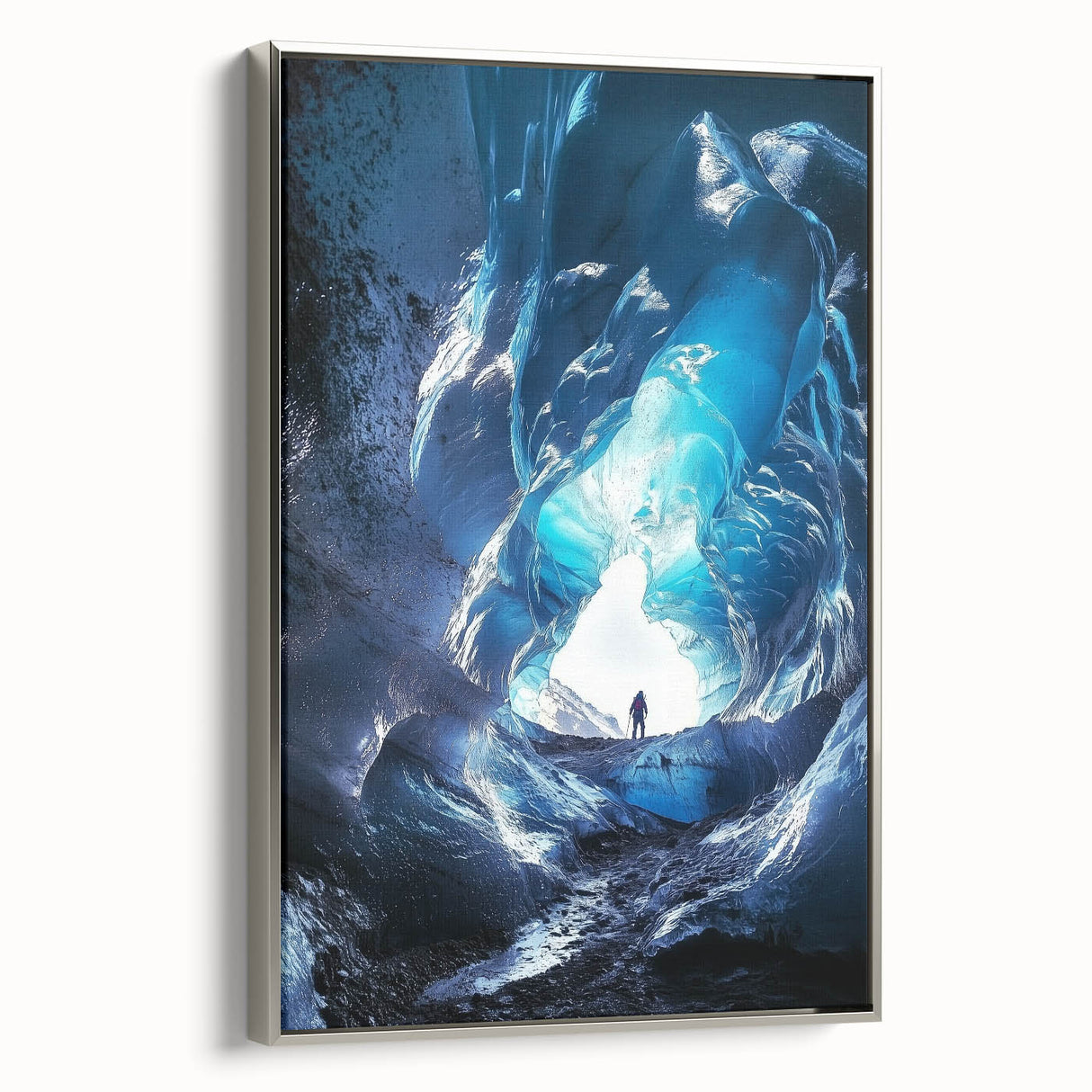 Framed canvas artwork showcasing a dramatic landscape scene with caves, featuring a sleek silver frame, ideal for modern home decor and artistic focal points.