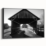 Black-framed landscape canvas featuring a serene barn scene, highlighting rustic charm and natural beauty, ideal for home decor or farmhouse aesthetics.