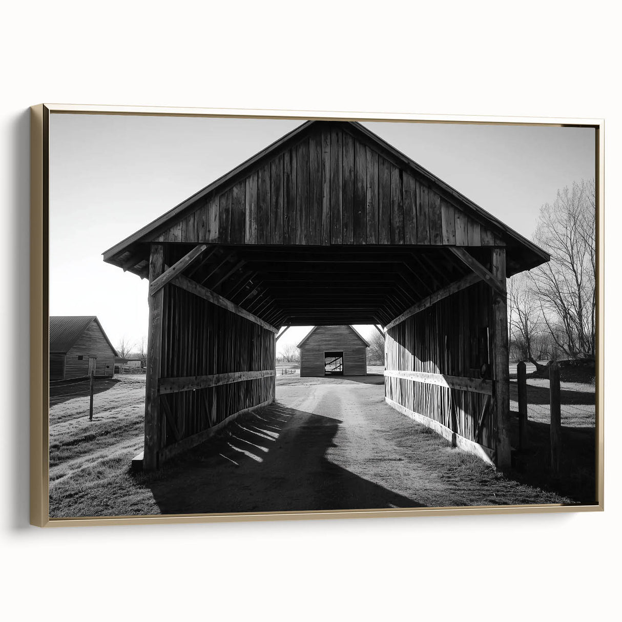 Gold-framed landscape canvas art depicting a serene barn scene, showcasing warm earthy tones and detailed textures, ideal for rustic home decor.