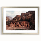 Framed landscape artwork depicting majestic canyons in vibrant colors, highlighted with a sleek silver mat and frame, perfect for enhancing home decor.