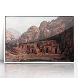 Framed acrylic landscape artwork depicting vibrant canyons in warm hues, set in a sleek white frame, perfect for enhancing modern home decor.