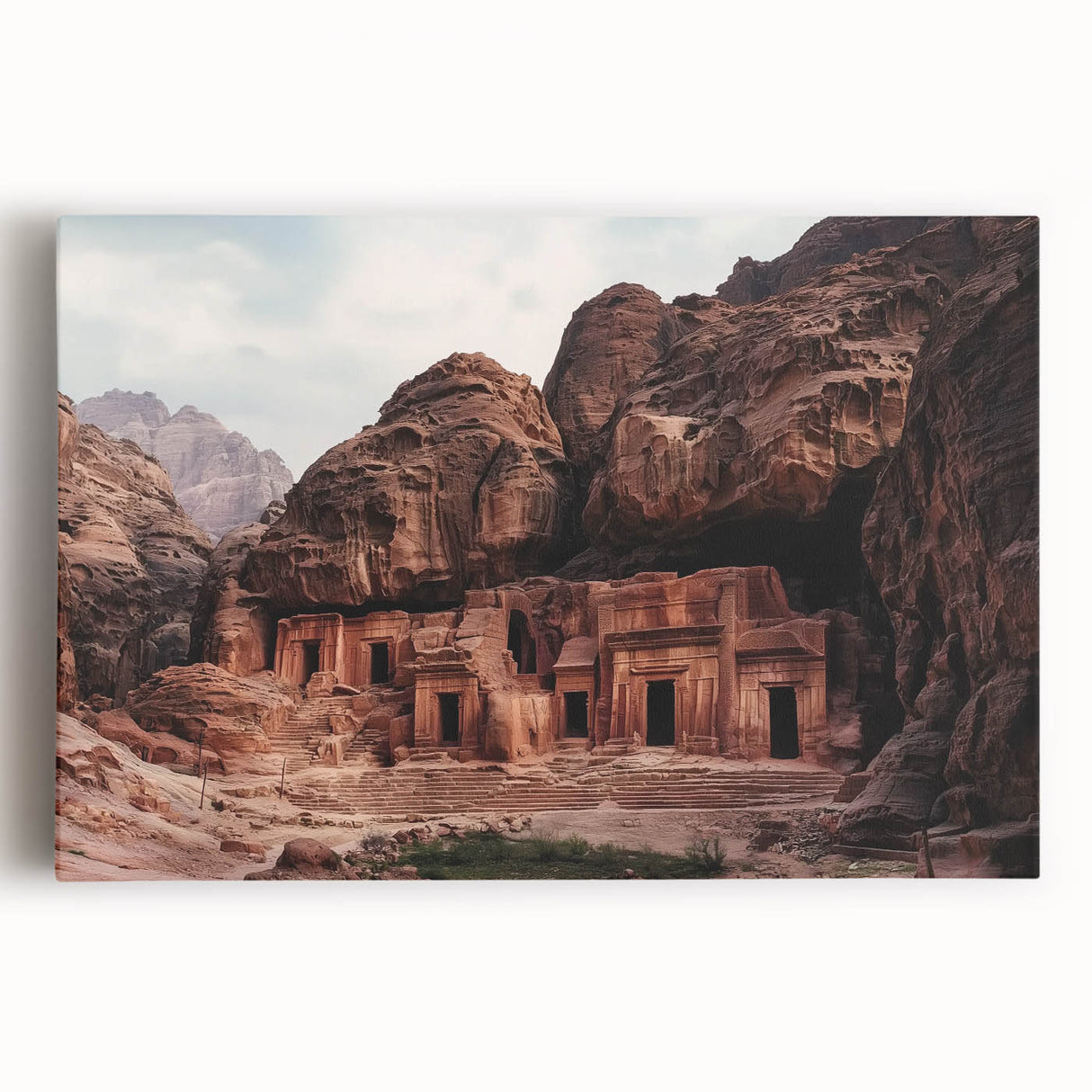 Stretched canvas artwork showcasing a vibrant landscape of canyons at sunset, highlighting rich orange and purple hues with dramatic rock formations, ideal for home decor.