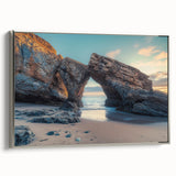 Framed canvas artwork depicting a serene countryside landscape, featuring vibrant greens and a soft blue sky, elegantly displayed with a silver frame, ideal for home decor.