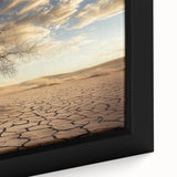 Close-up of a framed canvas showcasing a vibrant desert landscape with warm hues of orange and yellow, ideal for home decor enthusiasts seeking nature-inspired art.