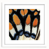 Abstract art print featuring close-up animal motifs in muted earth tones, framed with a white mat.